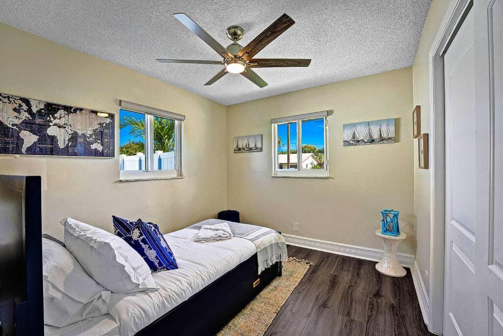 Holiday home New Stunning Delray Waterfront Oasis - Heated Pool, Spa, Canal, Dock, Huge Patio, Pool Table!