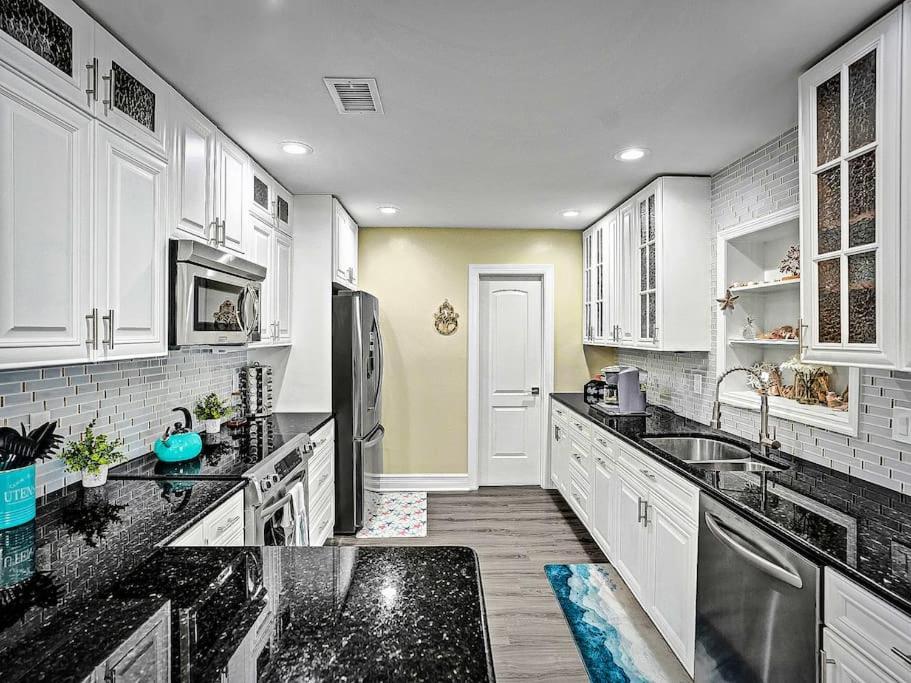 Holiday home New Stunning Delray Waterfront Oasis - Heated Pool, Spa, Canal, Dock, Huge Patio, Pool Table! *