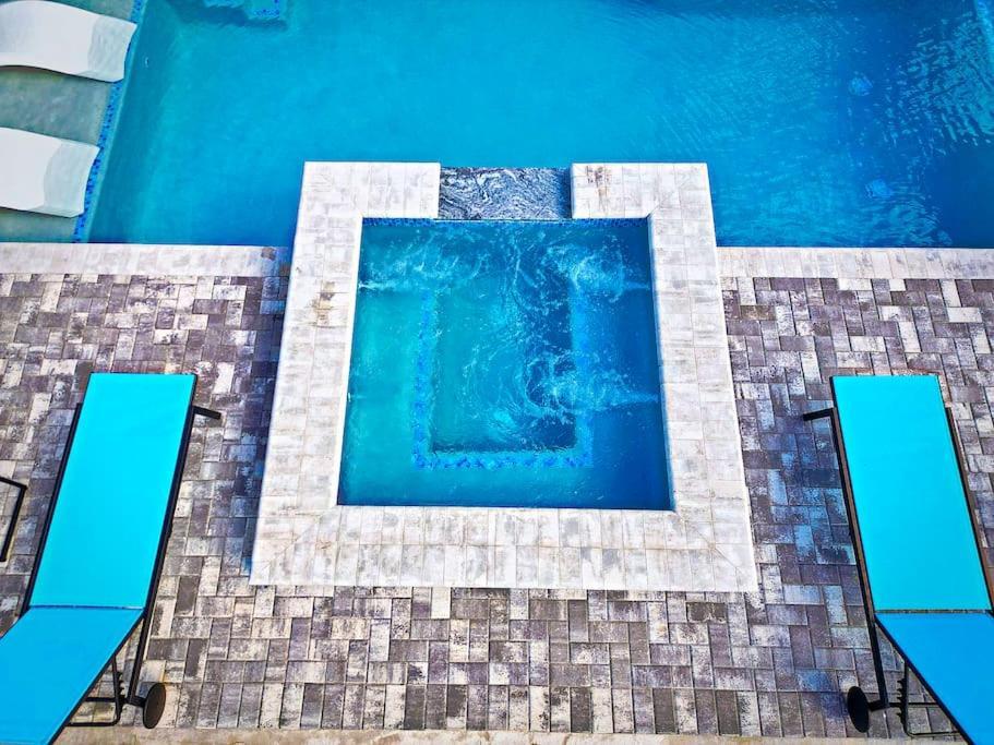 Holiday home New Stunning Delray Waterfront Oasis - Heated Pool, Spa, Canal, Dock, Huge Patio, Pool Table! *